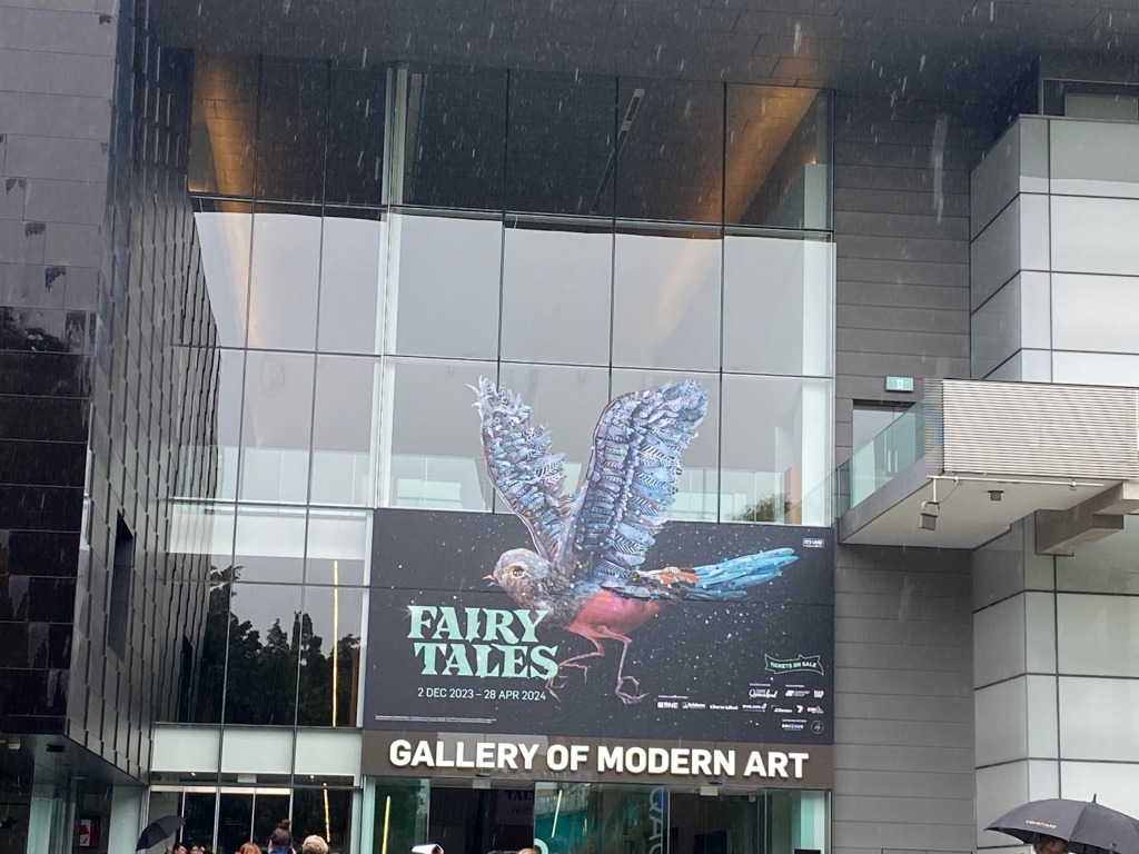 Front of museum, exhibition sign with bird on it